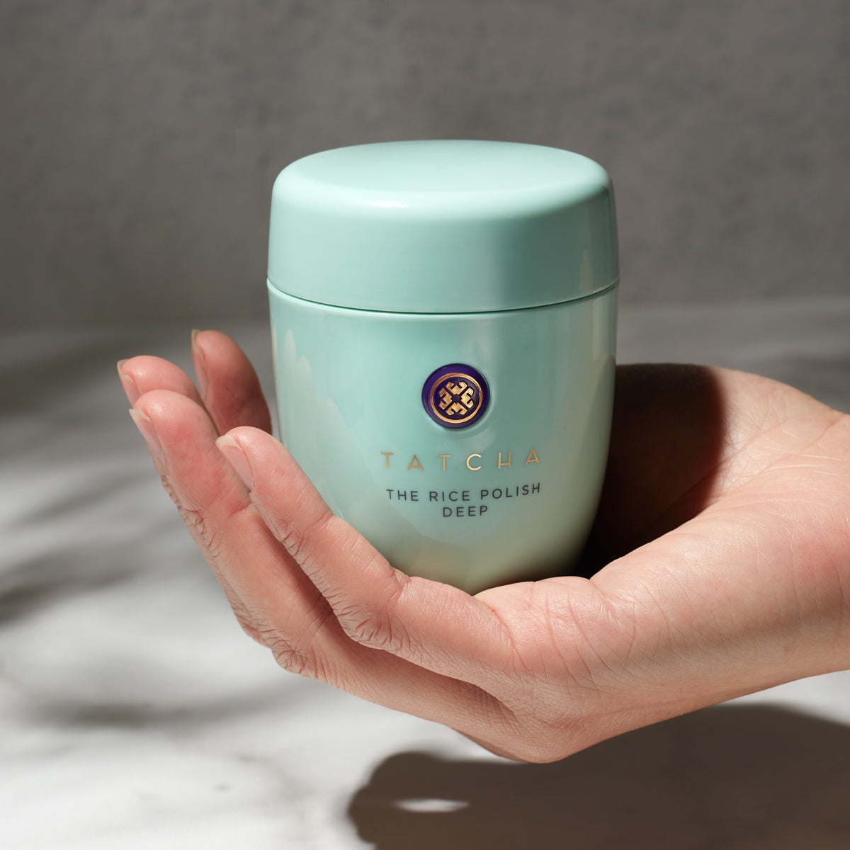 Hand holding the Rice Polish: Deep
